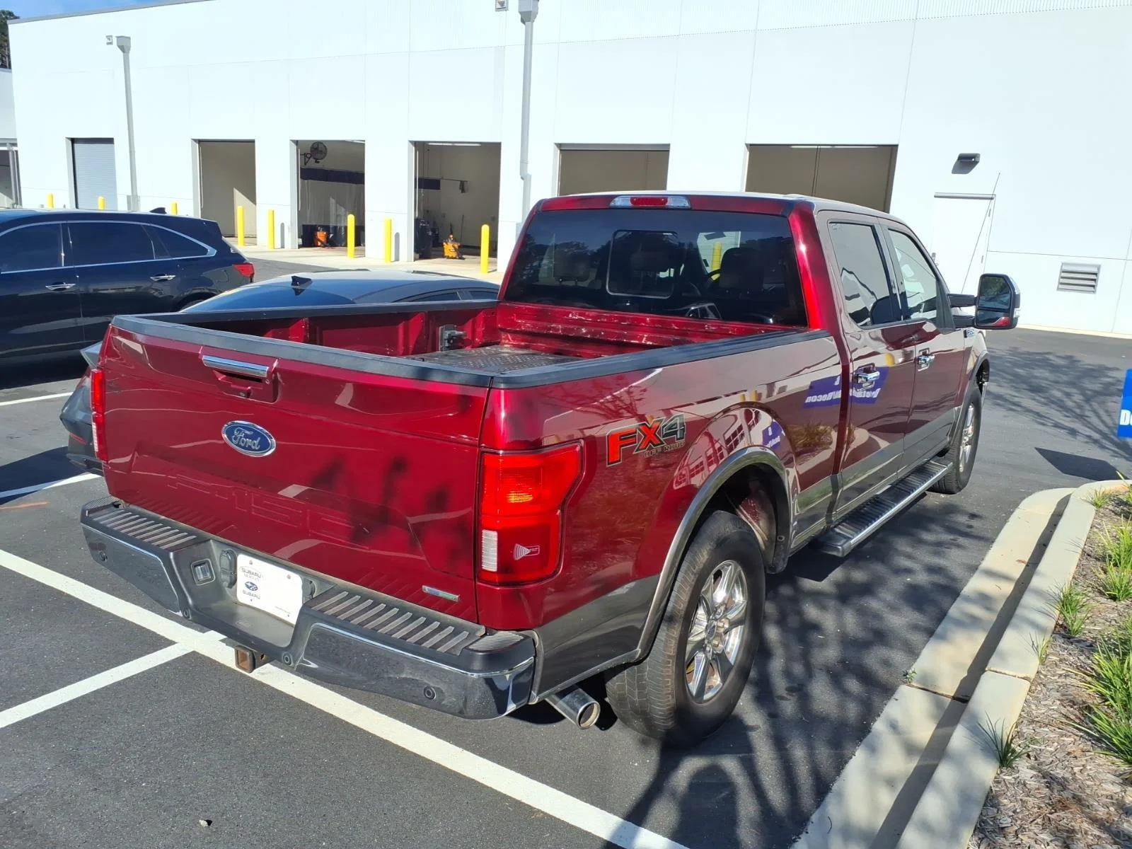 Used 2018 Ruby Red Metallic Tinted Clearcoat/Stone Gray Ford LARIAT image 5