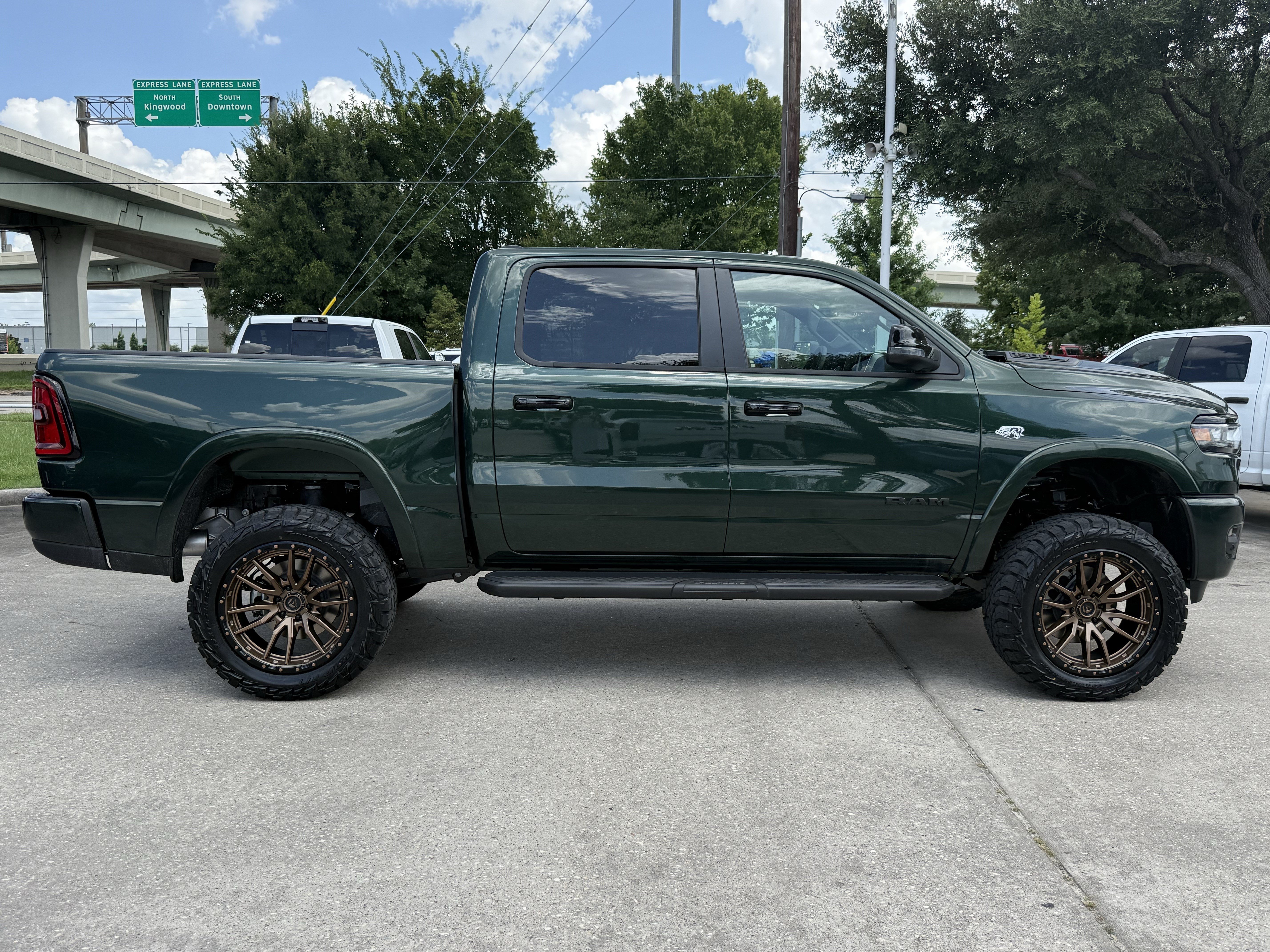 New 2026 Serrano-Green Metallic Exterior Paint RAM Laramie image 3