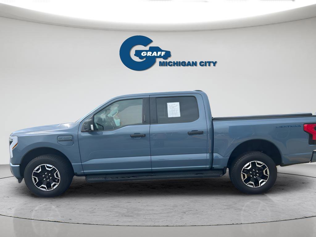 Used 2023 Ford F-150 Lightning XLT with VIN 1FTVW1EL9PWG55360 for sale in Michigan City, IN