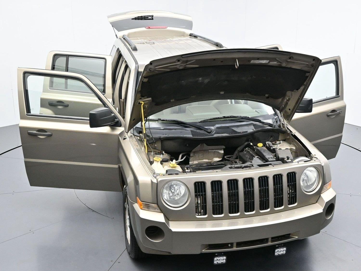 Used 2008 Light Khaki Metallic Jeep Sport image 37