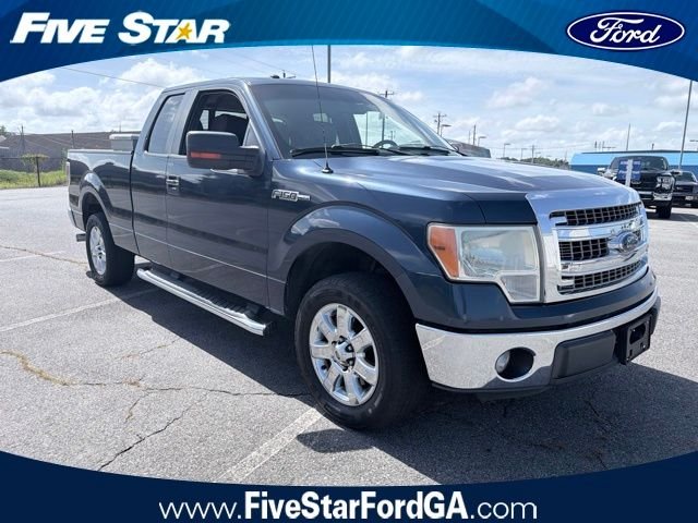 Used 2013 Blue Ford XLT image 1