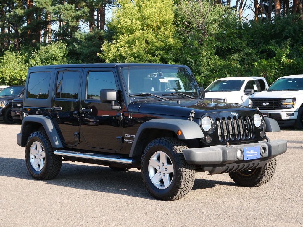 Used 2013 Black Jeep Unlimited Sport image 1