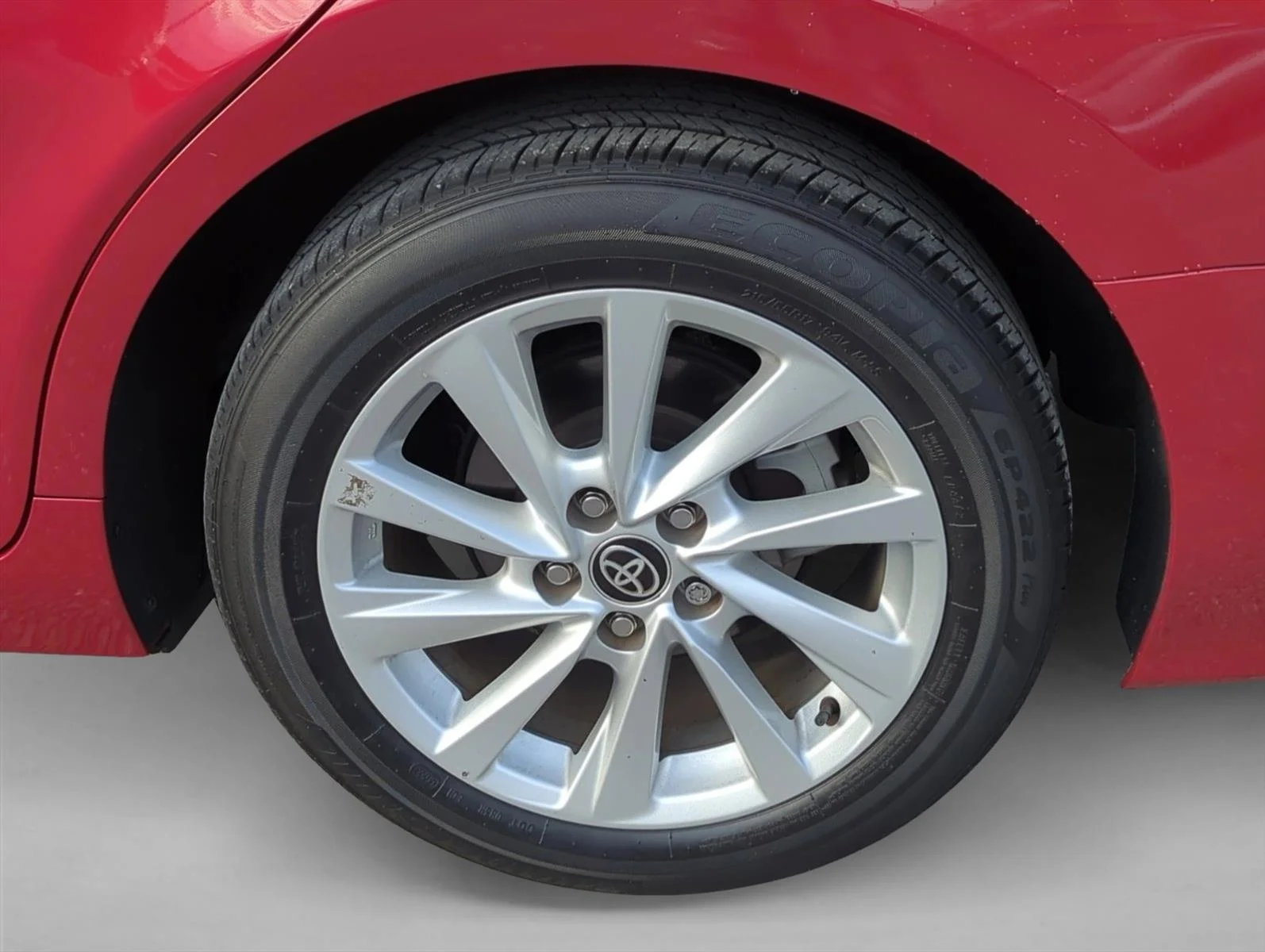 Used 2024 Supersonic Red Toyota LE image 7