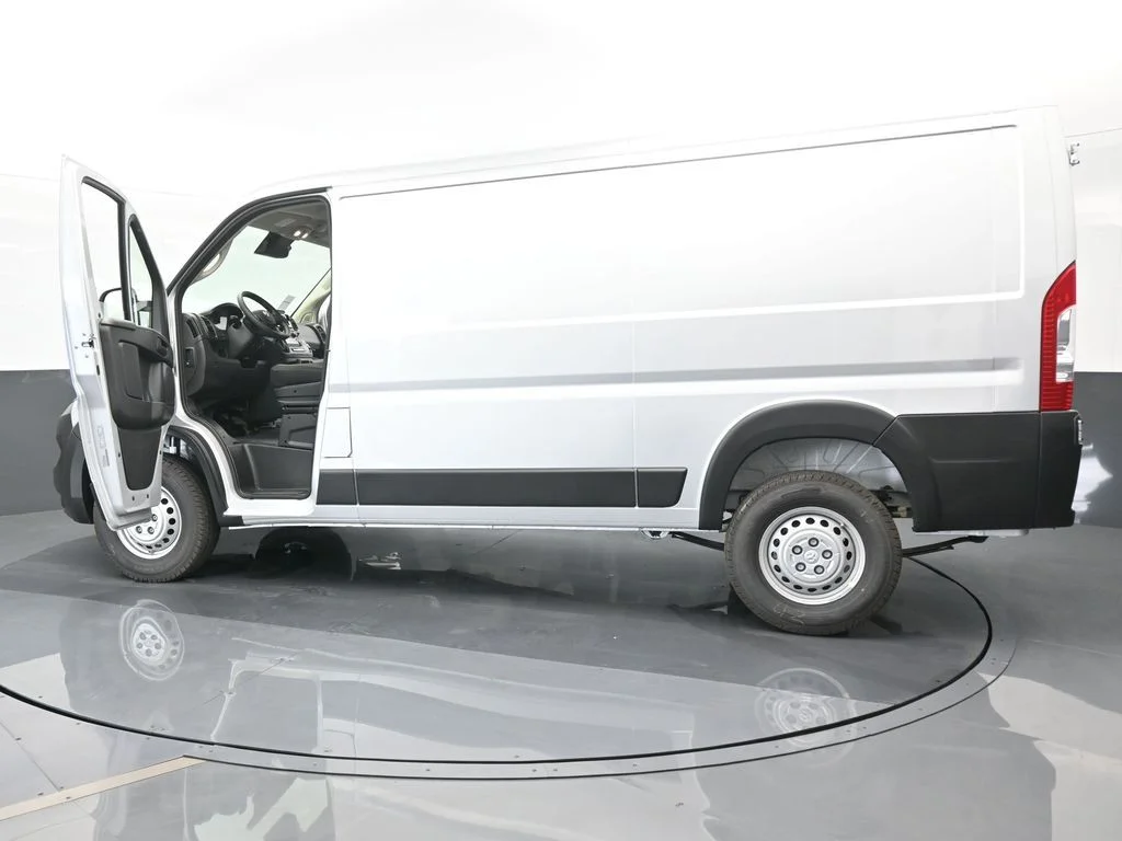 Used 2025 Bright Silver Clearcoat Metallic Ram Low Roof image 65