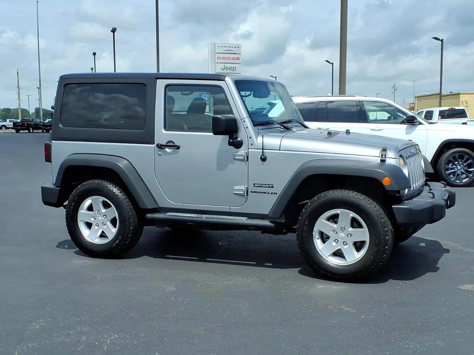 Used 2013 Billet Silver Metallic Clear Coat Jeep Sport image 2
