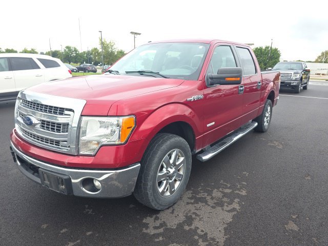 Used 2013 Ruby Red Metallic Ford XLT image 1