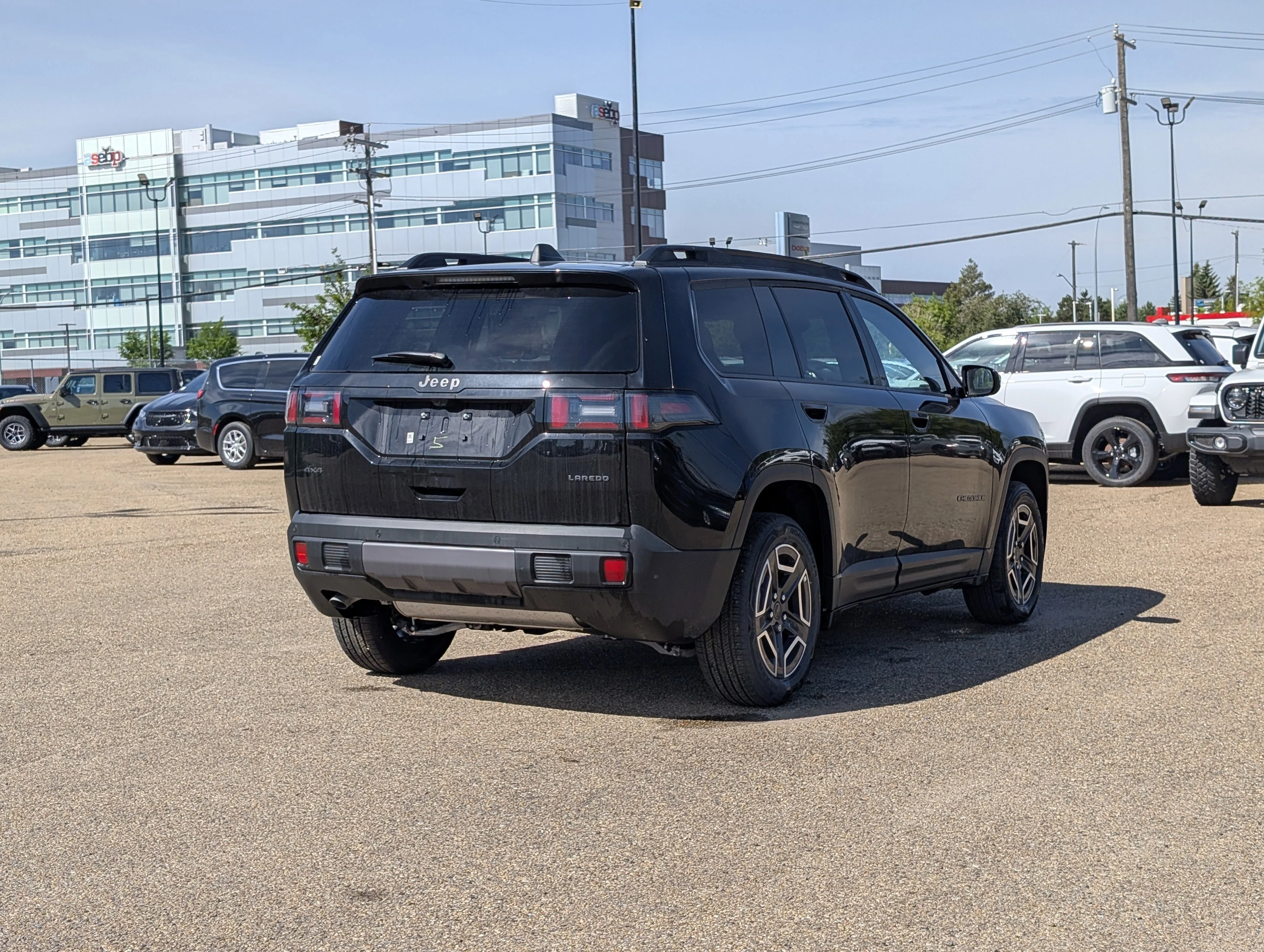 New 2026 Diamond Black Crystal Pearl Jeep Laredo image 7