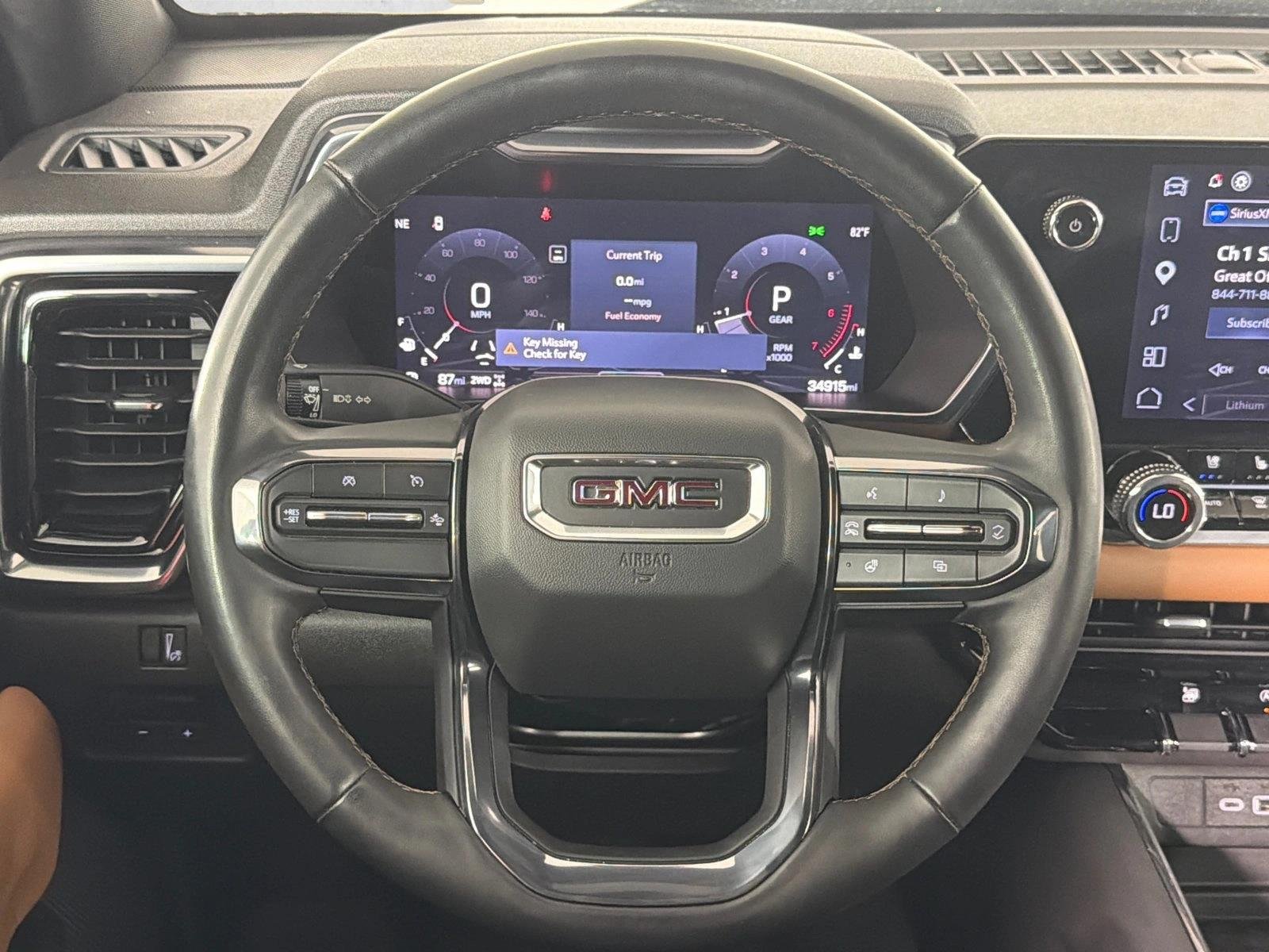 Used 2024 Sterling Metallic GMC 4WD AT4 image 23
