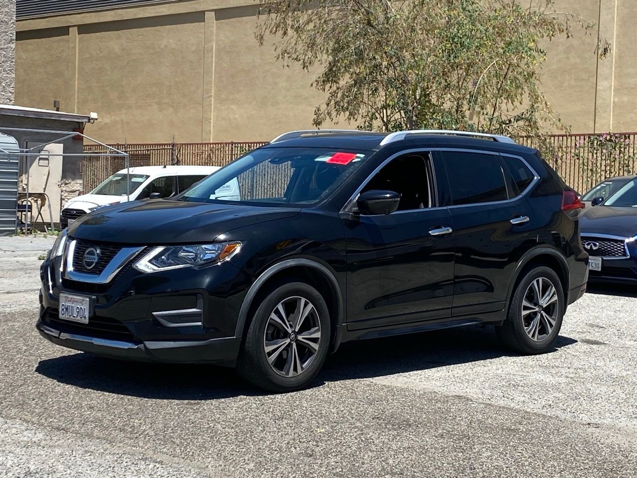 Used 2019 Magnetic Black Pearl Nissan SV image 1