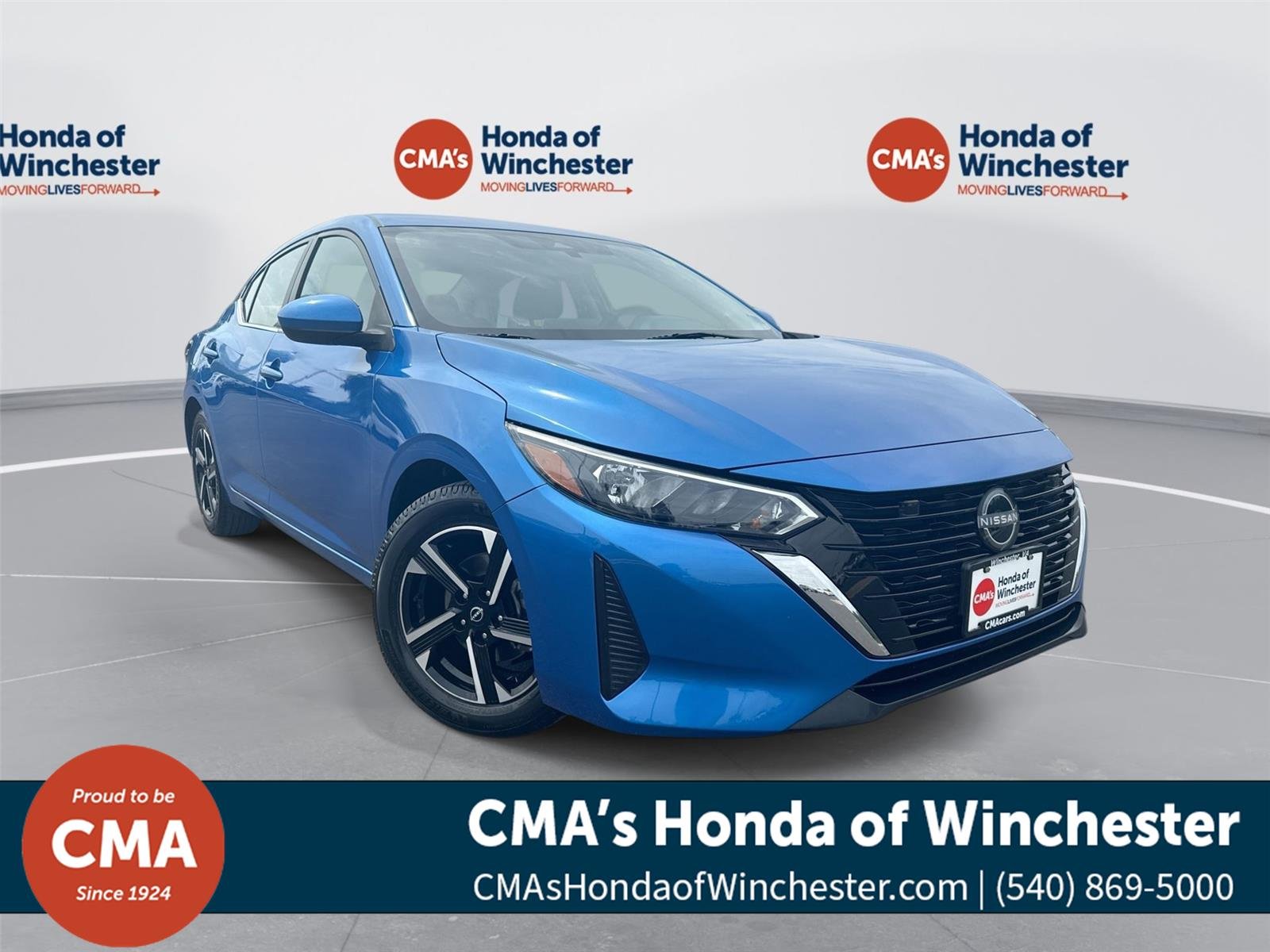 Used 2025 Electric Blue Metallic Nissan SV image 1