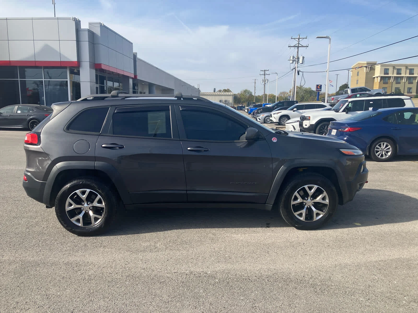 Used 2015 Granite Crystal Metallic Clearcoat Jeep Trailhawk image 8