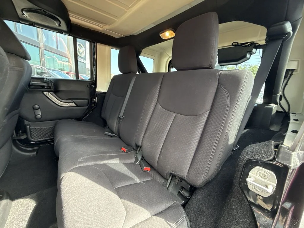 Used 2013 Black Jeep Unlimited Sport image 22