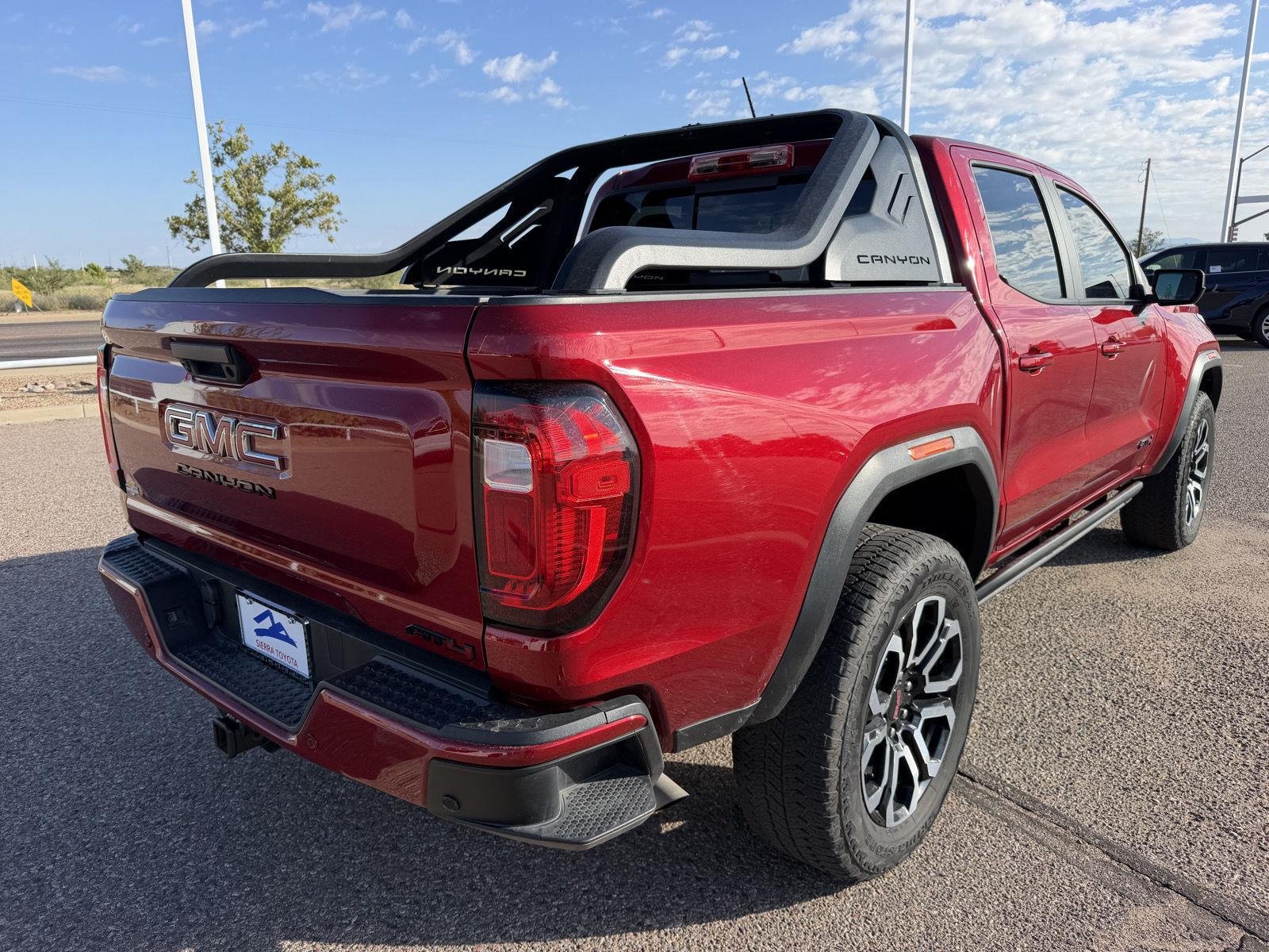 Used 2025 Volcanic Red Tintcoat GMC 4WD AT4 image 6