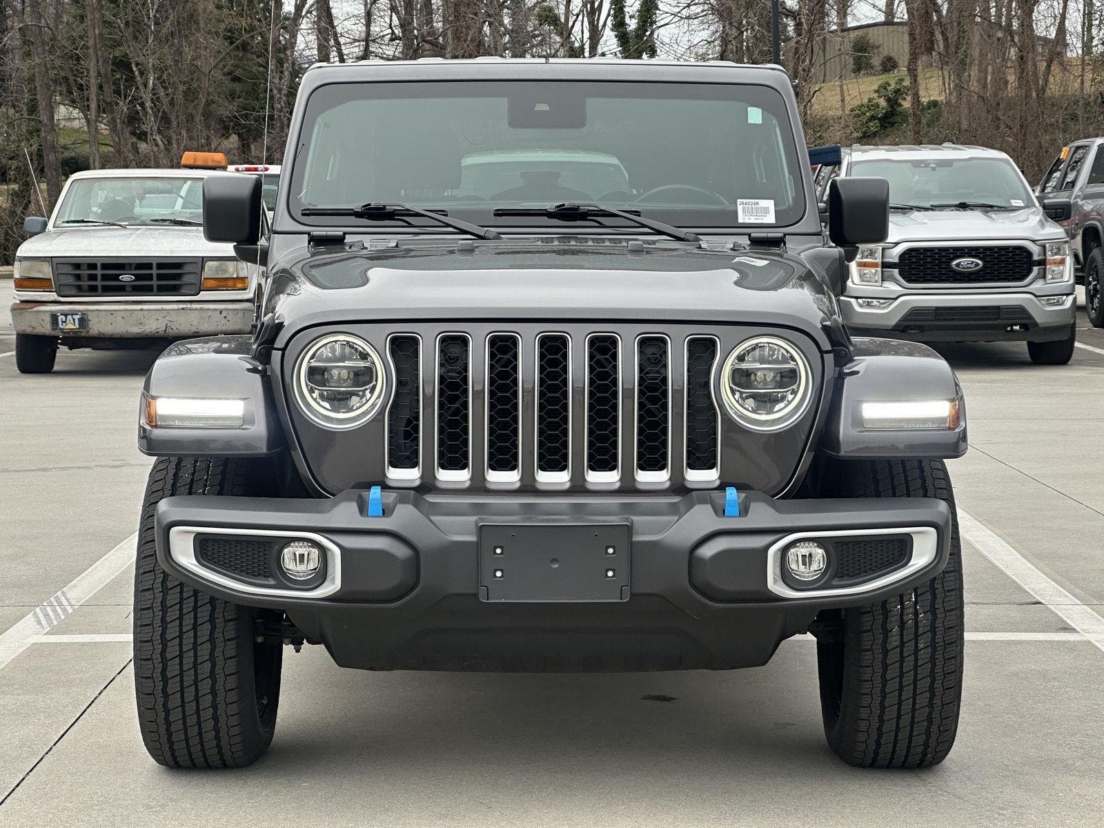 Used 2022 Jeep Wrangler Unlimited Sahara 4XE with VIN 1C4JJXP6XNW268028 for sale in Clayton, GA