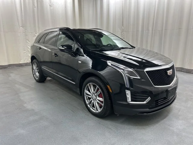 Used 2024 Black Cadillac Sport image 1