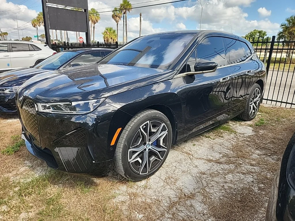 Used 2024 Black Sapphire Metallic BMW xDrive50 image 1
