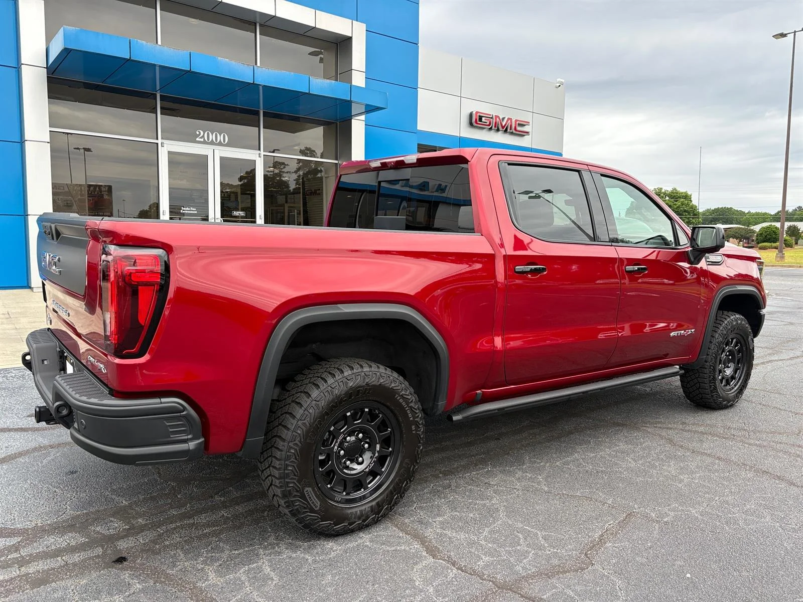 Used 2026 Volcanic Red Tintcoat GMC AT4X image 6