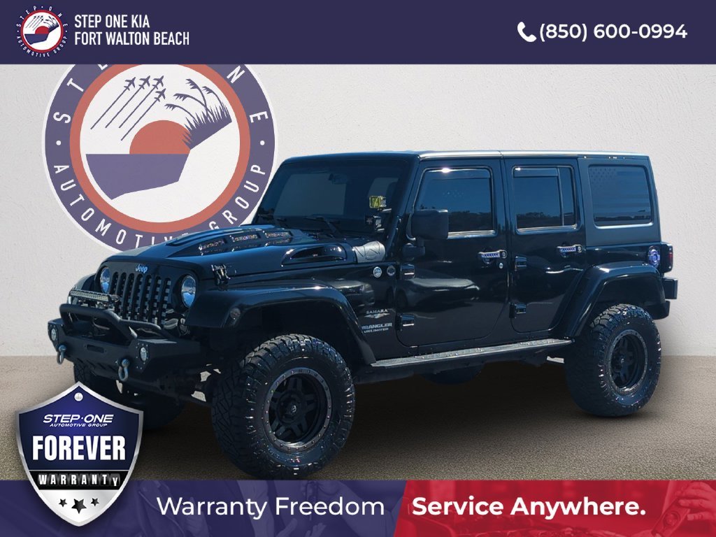 Used 2015 Black Jeep Unlimited Sahara image 1