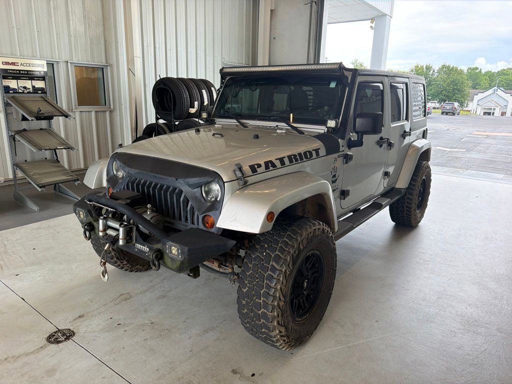 Used 2012 Bright Silver Metallic Clearcoat Jeep Sahara image 1