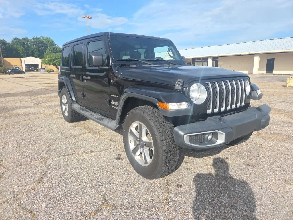 Used 2018 Black Jeep Unlimited Sahara image 1