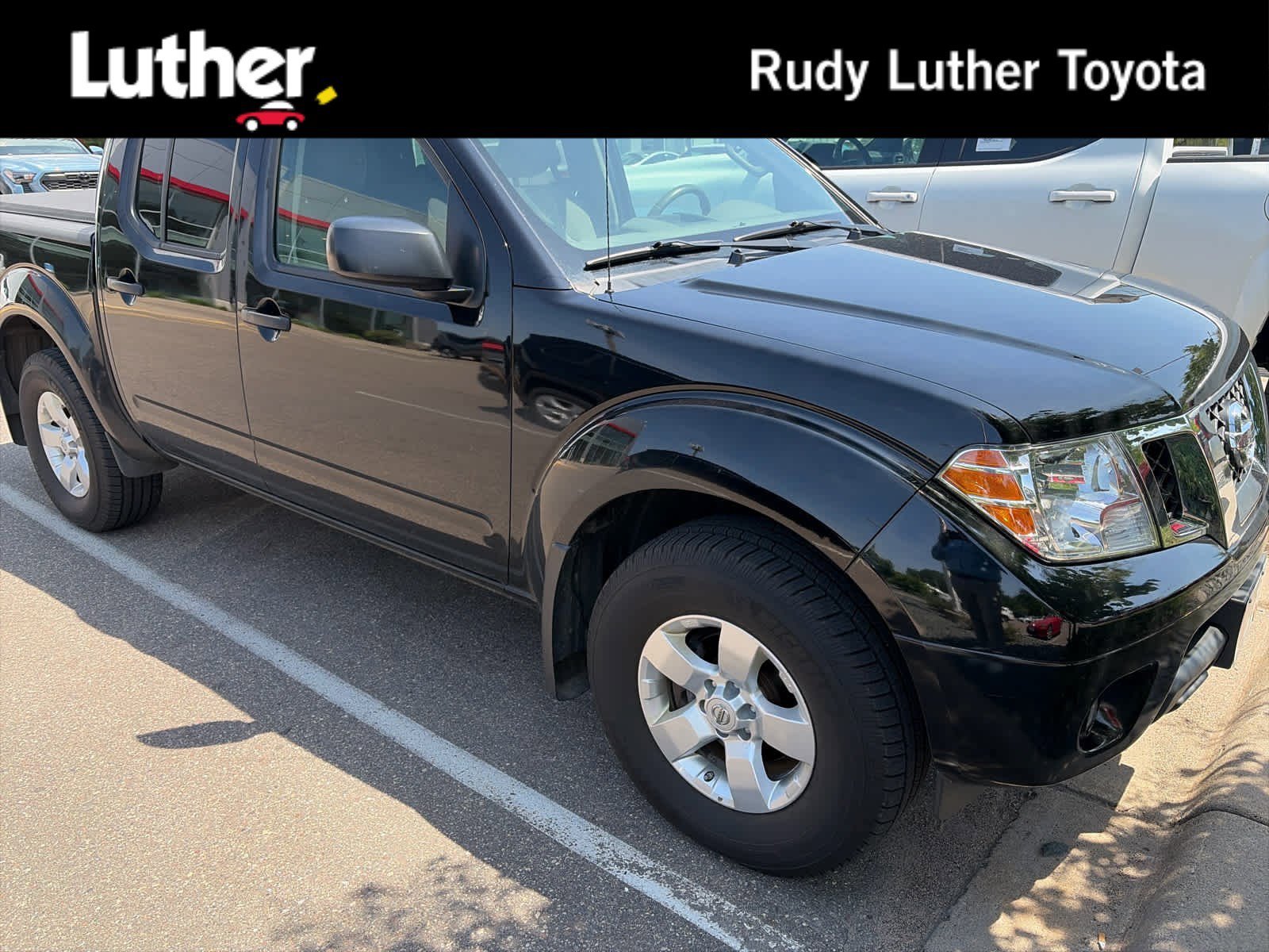 Used 2013 Super Black Nissan SV image 1