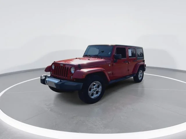 Used 2014 Red Jeep Unlimited Sahara image 4