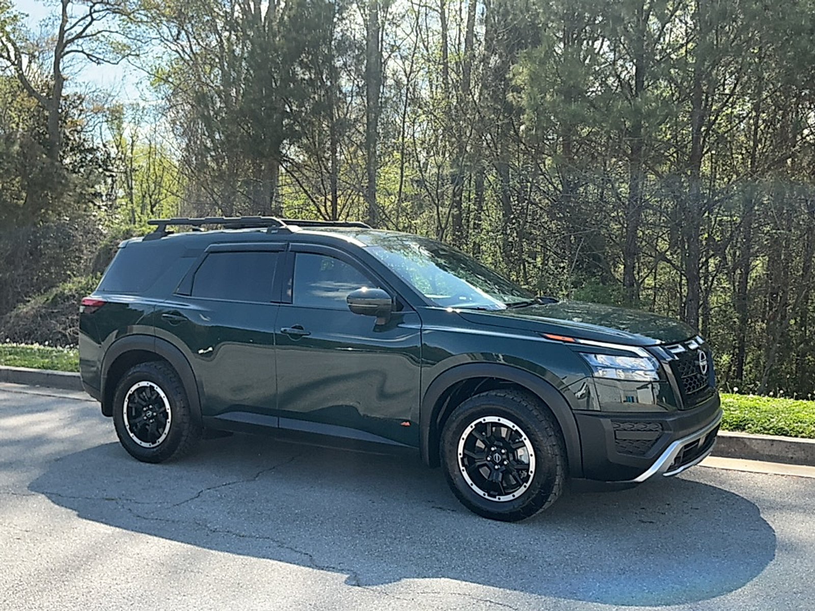 Used 2024 Obsidian Green Pearl Nissan Rock Creek 4WD image 1