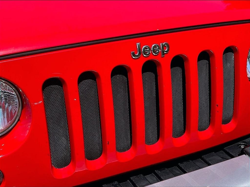 Used 2015 Red Jeep Unlimited Sahara image 28