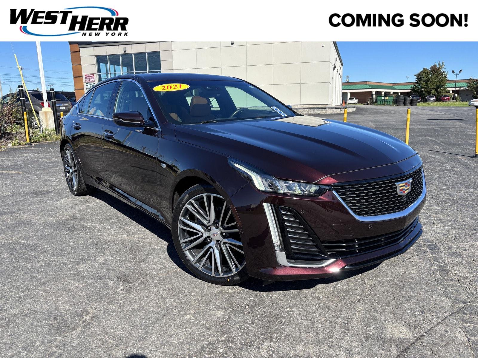 Used 2021 Garnet Metallic Cadillac Premium Luxury image 1