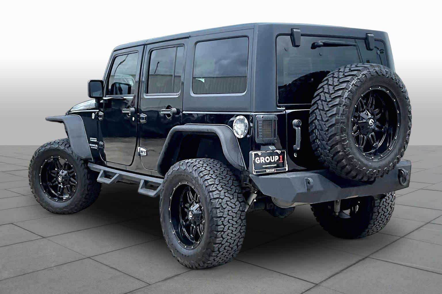 Used 2014 Black Clearcoat Jeep Sport image 11