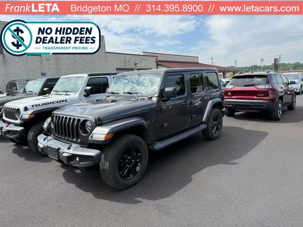 Used 2018 Red Jeep Unlimited Sahara image 1