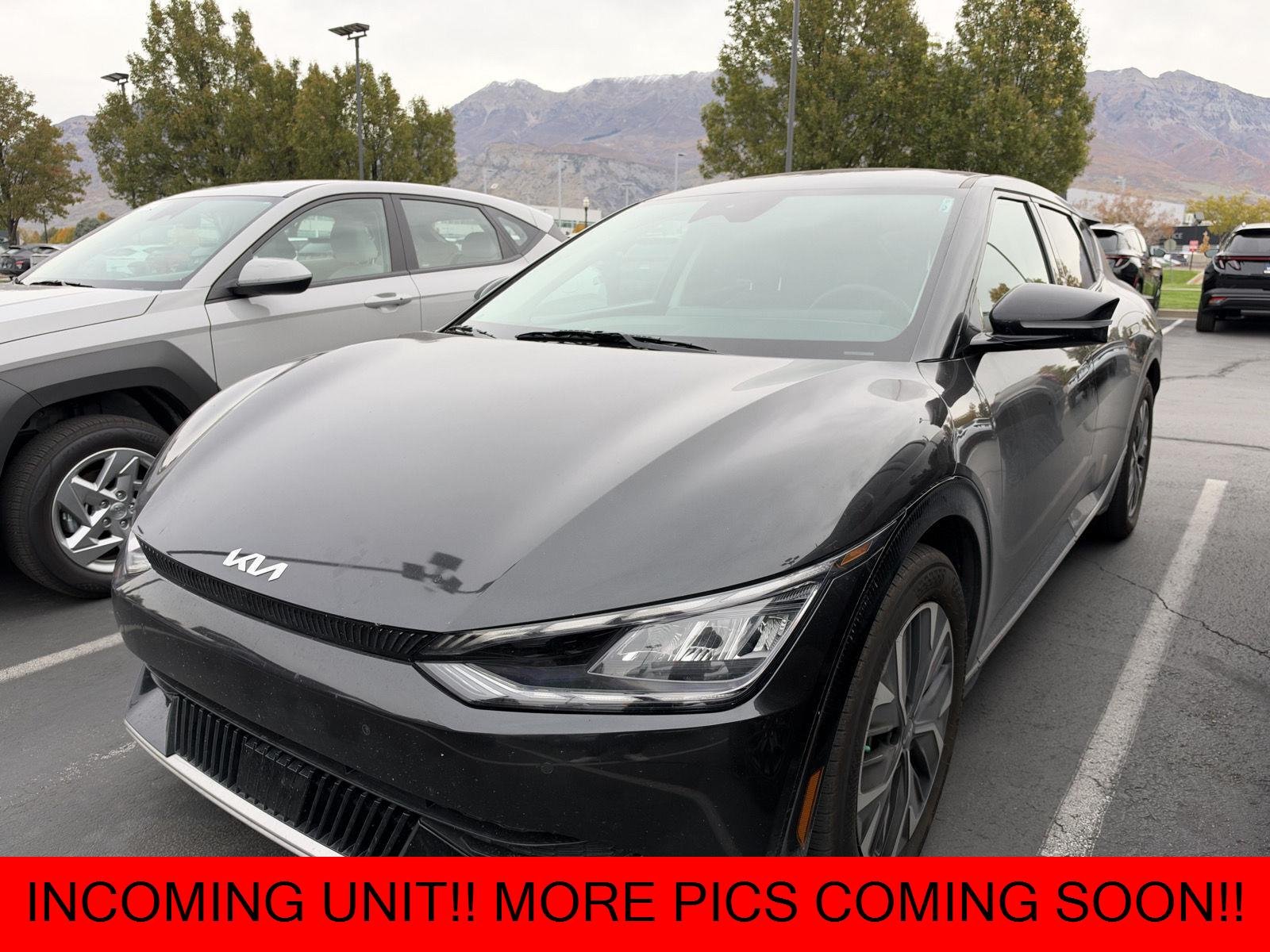 Used 2024 Interstellar Gray kia Wind image 1
