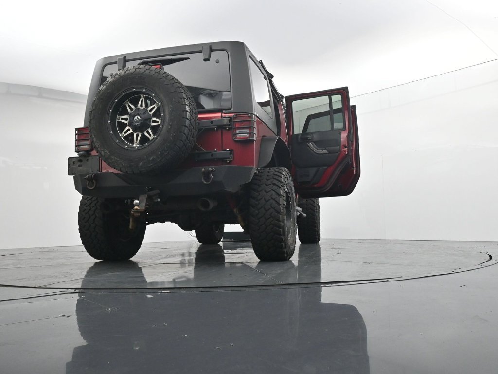 Used 2012 Red Jeep Unlimited Sport image 30