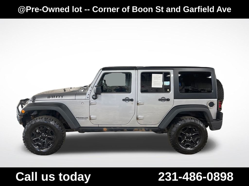 Used 2015 Silver Jeep Unlimited Sport image 2
