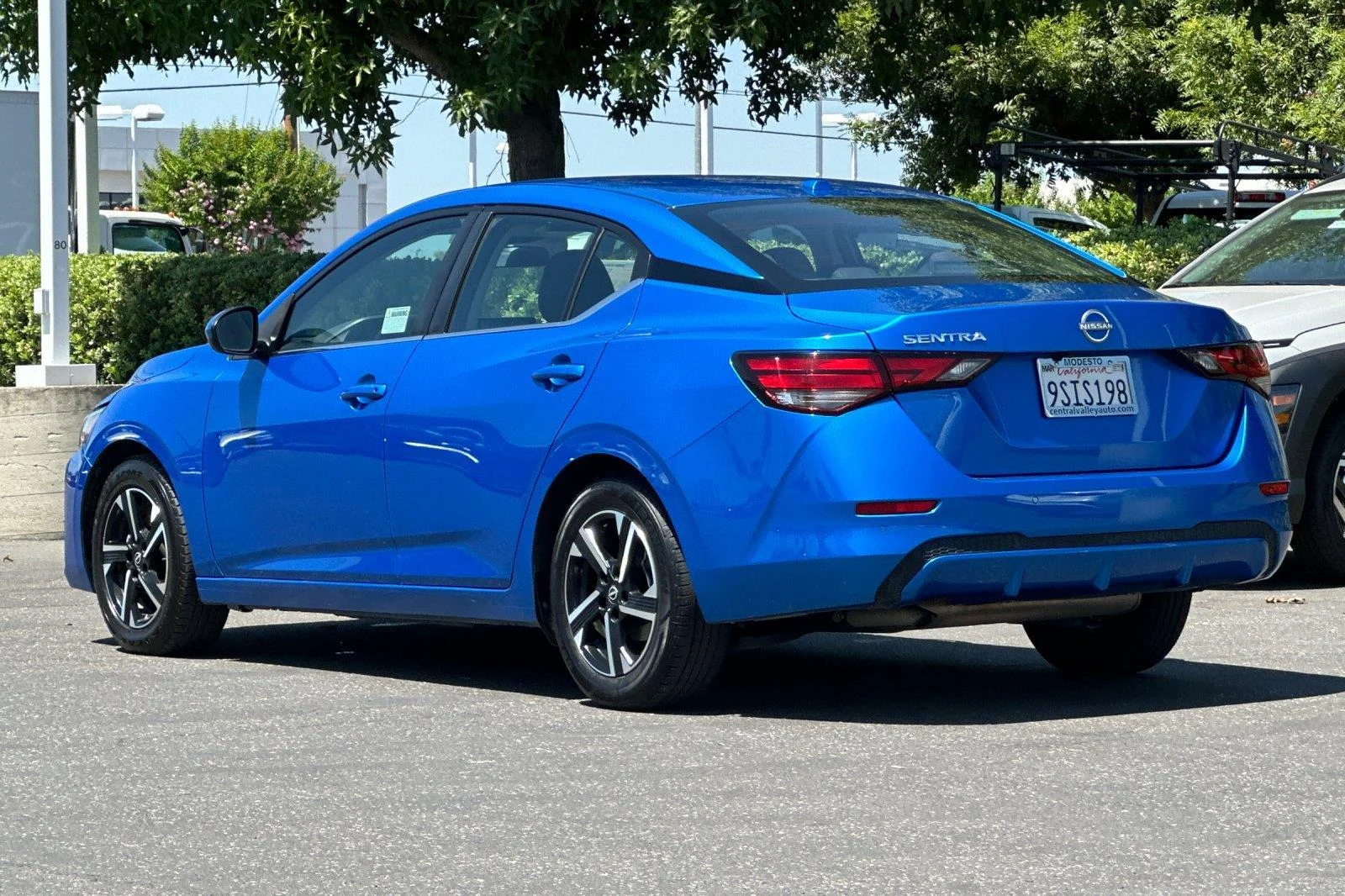 Used 2025 Electric Blue Metallic Nissan SV image 6