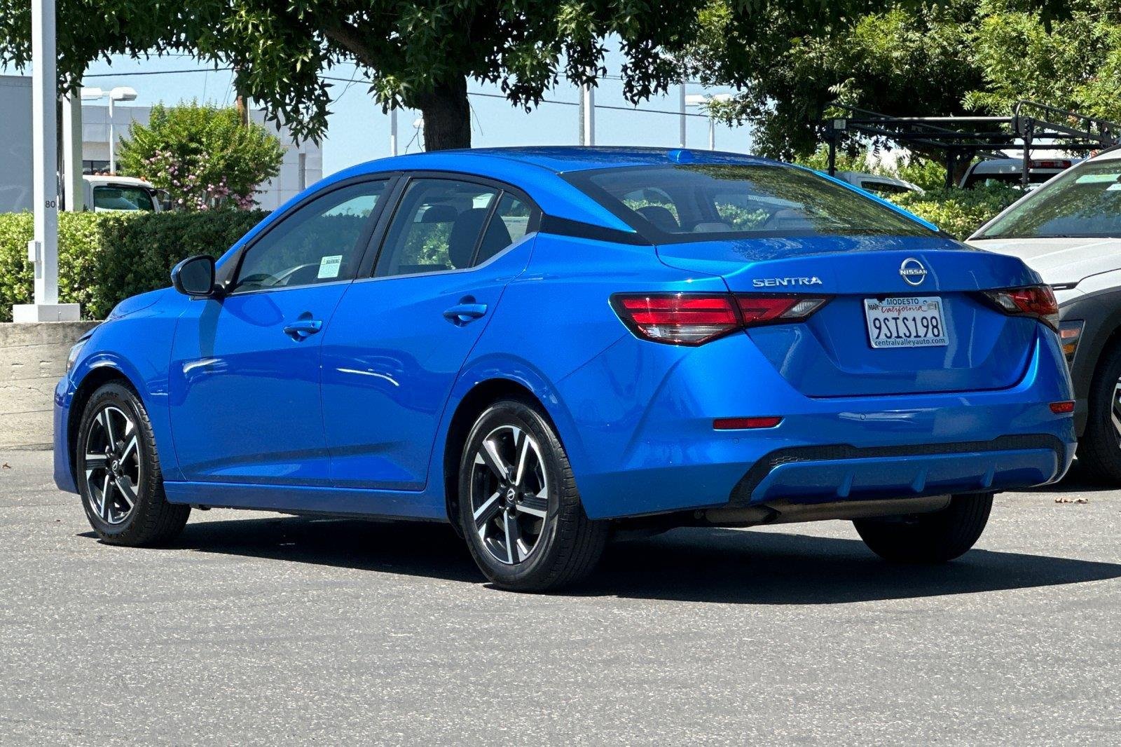 Used 2025 Electric Blue Metallic Nissan SV image 6