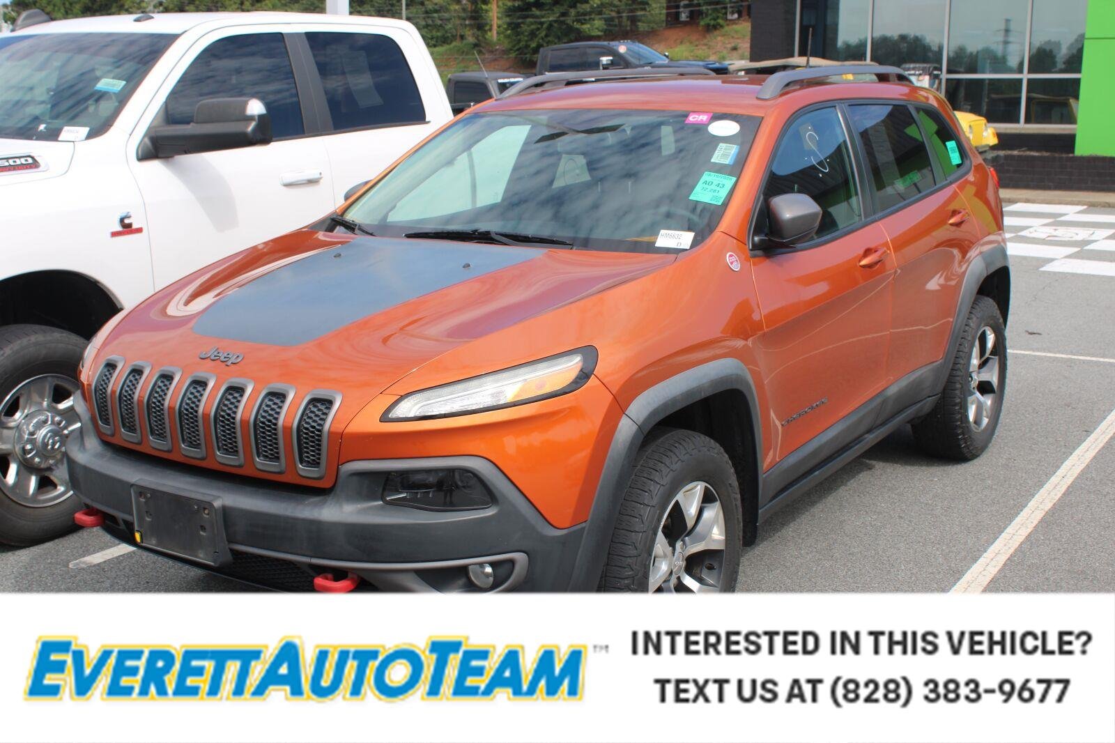 Used 2015 Mango Tango Pearlcoat Jeep Trailhawk image 1