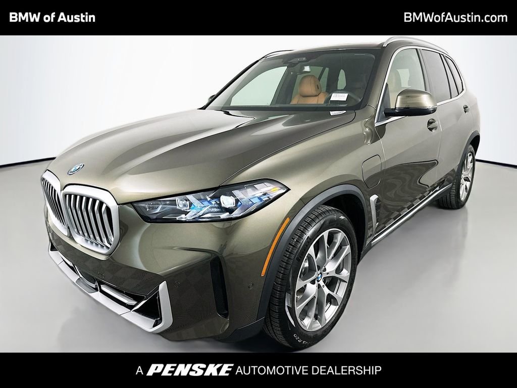 Used 2026 Manhattan Green Metallic BMW xDrive50e image 1
