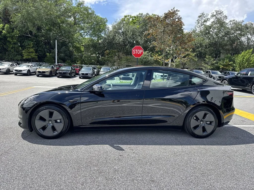 Used 2023 Solid Black Tesla  image 11