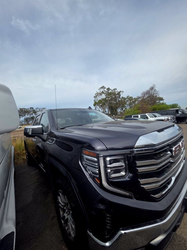 Used 2025 Titanium Rush Metallic GMC SLT image 1