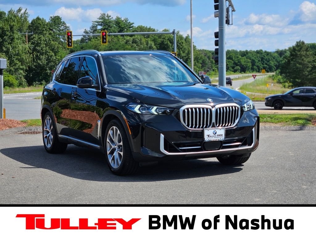 Certified Used 2026 Black Sapphire Metallic BMW xDrive50e image 1