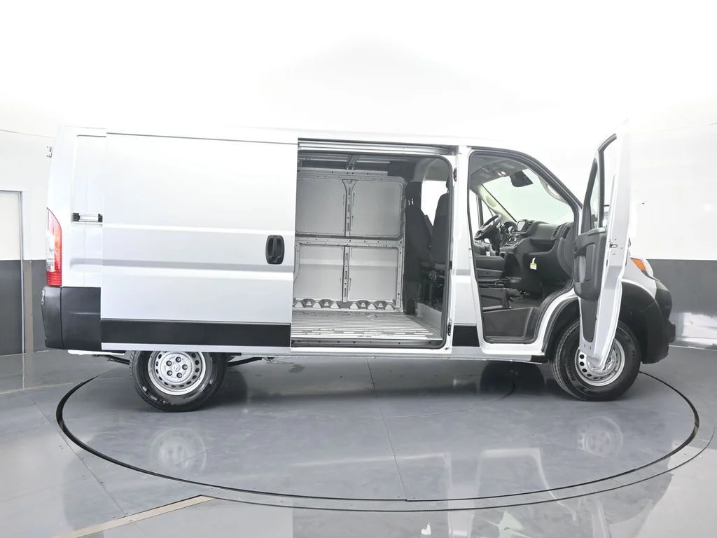 Used 2025 Bright Silver Clearcoat Metallic Ram Low Roof image 63
