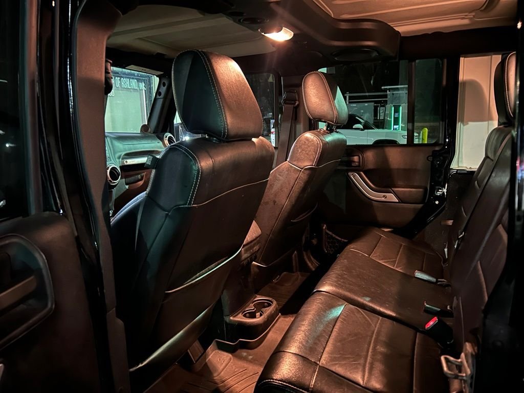 Used 2012 Black Jeep Unlimited Sahara image 4