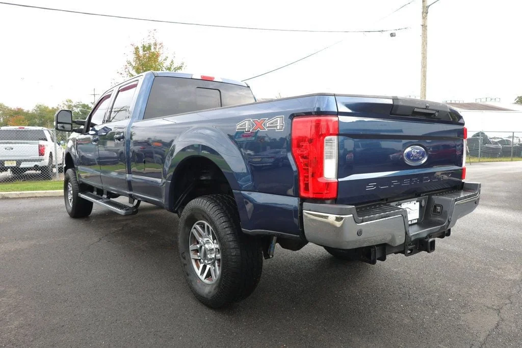 Used 2019 Blue Jeans Metallic Ford LARIAT 4WD Crew Cab 6.75