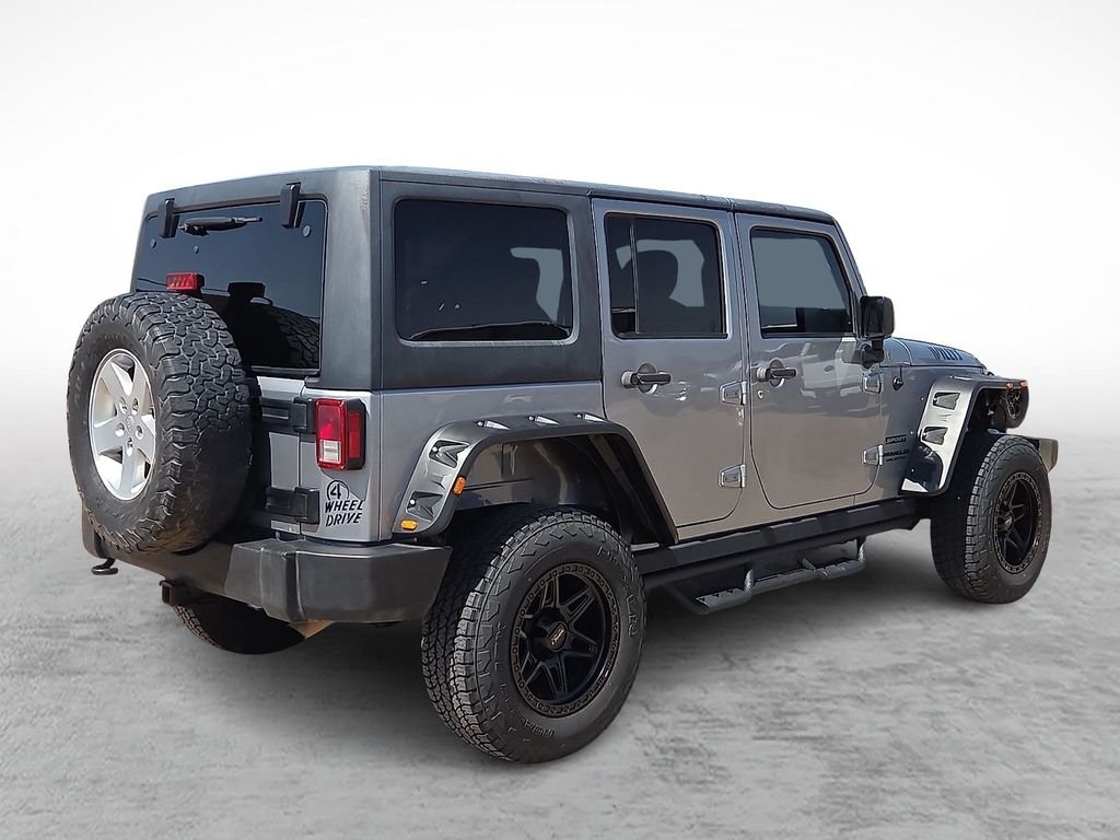 Used 2016 Billet Silver Metallic Clearcoat Jeep Unlimited Sport image 11
