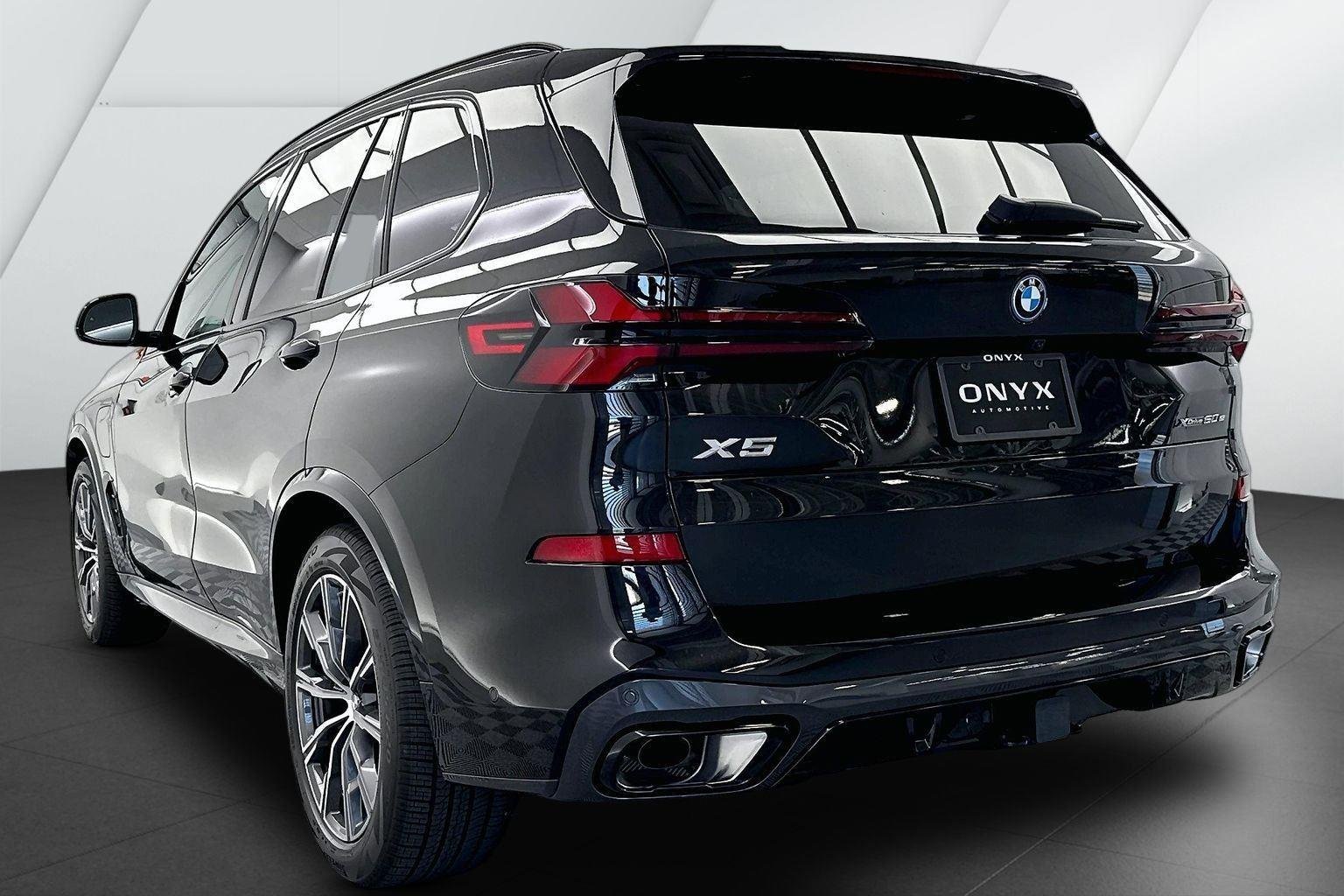New 2026 Black Sapphire Metallic BMW xDrive50e image 7