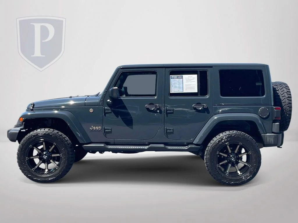 Used 2016 Black Jeep Unlimited Sahara image 5