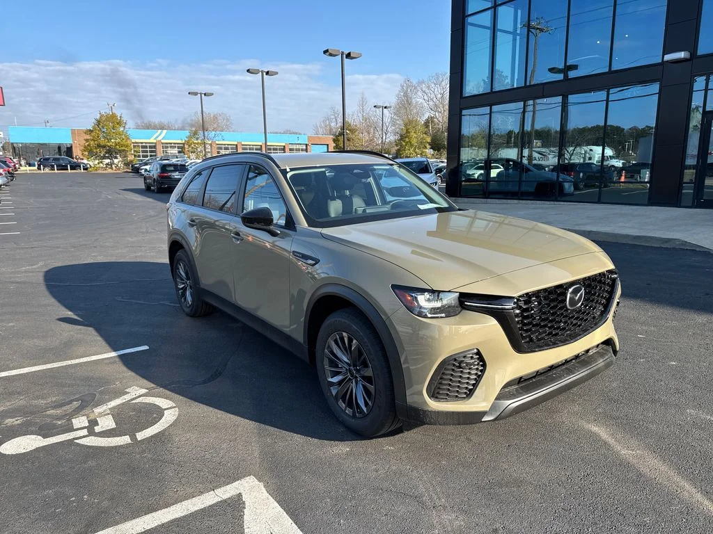 New 2026 Sand Metallic Mazda SC Plus image 1