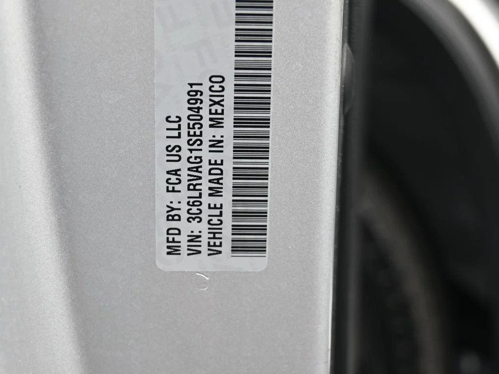 Used 2025 Bright Silver Clearcoat Metallic Ram Low Roof image 17