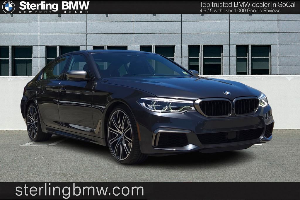 Used 2018 Dark Graphite Metallic BMW M550i xDrive image 1